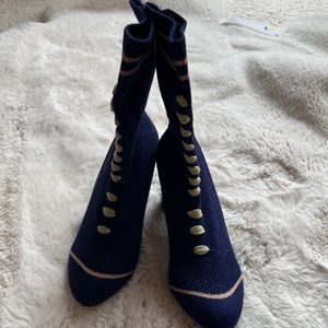 Very cute navy with tan ankle boot. Size 7
